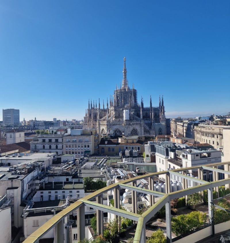 The FI Multicare terrace in Galleria del Corso, Milan, overlooking the spires of the Duomo
