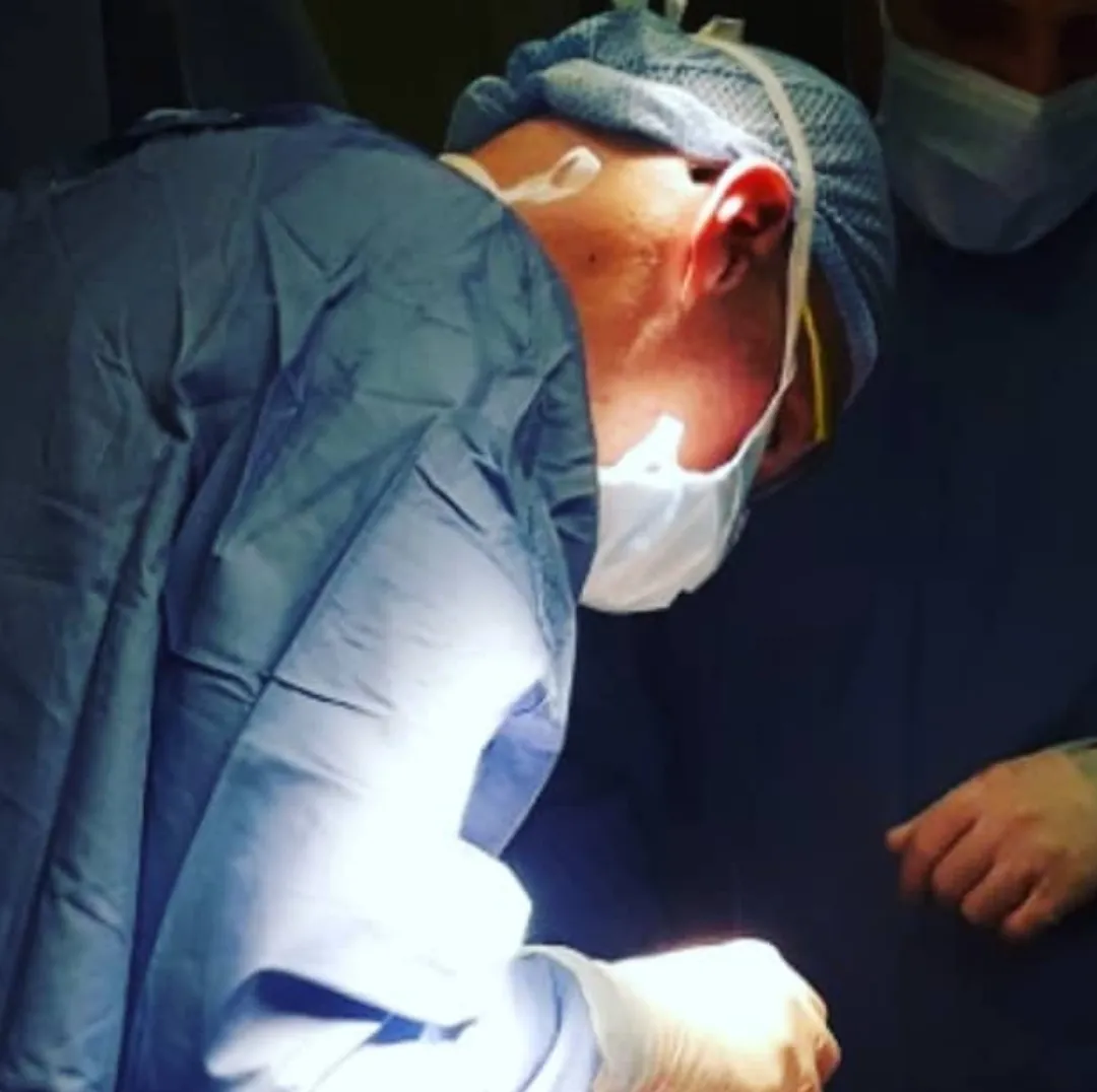 Open surgery: suprapubic incision and dissection of the skin-fat flap